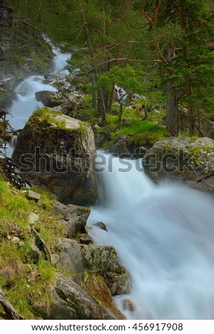 This is colorful waterfall in Caucasus mountains in summer