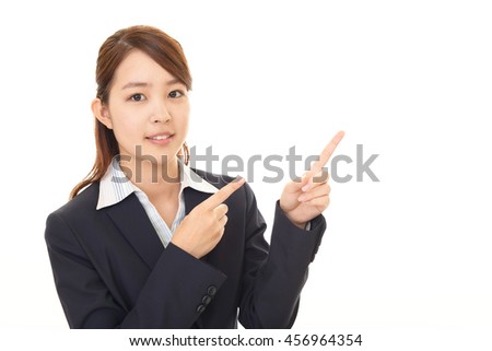 Business woman pointing with her fingers 