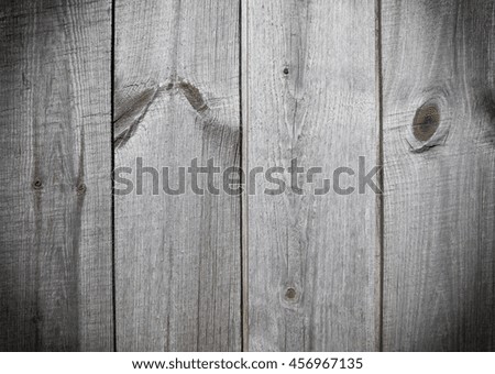Texture of rustic vintage gray wooden boards background with vignetting effect