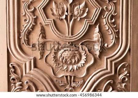 Details of a fine wood carving art. A Buddhist art and craft.In the temple of Thailand.