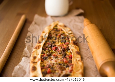 Turkish pide with cheese and cubed meat / kusbasili kasarli pide.