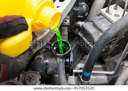 Pouring coolant Royalty-Free Stock Photo #457053520