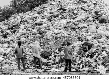 Abstract black and white blur picture of people in landfill of Thailand, Picture for background