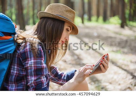 Pretty young woman searching for location