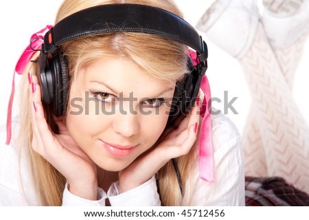Beautiful young blond girl in headphones