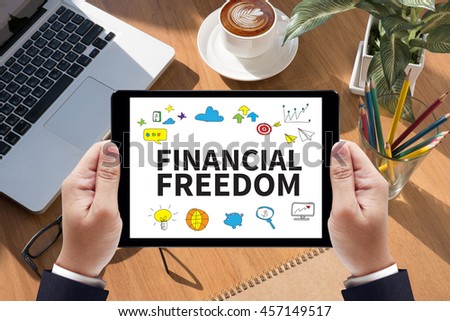 FINANCIAL FREEDOM Businessman work  on tablet on screen