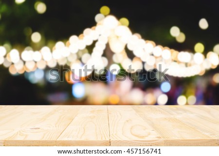 Table top free space and blurred street bokeh lights new year. For product display montage. Business presentation.