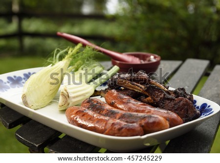 Plate with grilled sausages and ribs and fennel, picture from Sweden. 