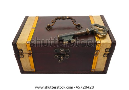 Gold  key on closed treasure chest , isolated with clipping path