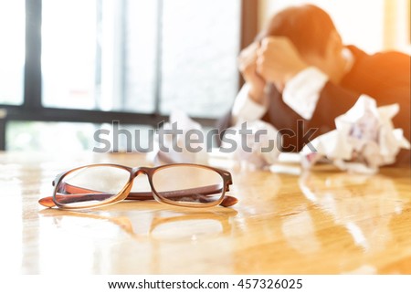 Depressed businessman ware suit in office, Business and depressed concept, soft focus, vintage tone