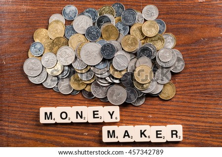 Coins with Money Maker Sign