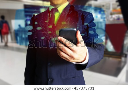 businessman hand holding and using a smart phone