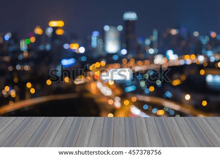 Opening wooden floor, City blurred bokeh lights at night