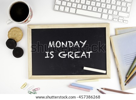 Chalkboard on office desk with text: Monday is a great