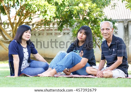 Funny family take a self photo in garden on holiday