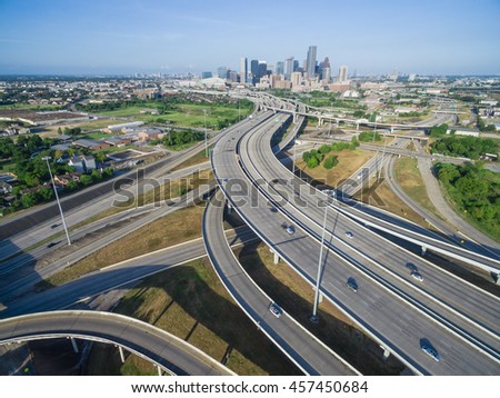 Aerial view Houston downtown and interstate 69 highway with massive intersection, stack interchange and elevated road junction overpass at early morning from the northeast side of Houston, Texas, USA