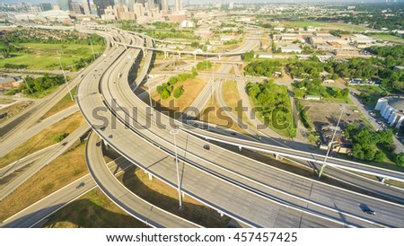 Panorama aerial view massive interstate I69 highway intersection, stack interchange with elevated road junction overpass in downtown Houston. This five-level freeway interchange carry heavy traffic.