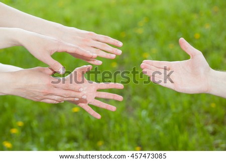 People offering help, natural green background