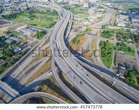 Aerial view massive interstate I69 highway intersection, stack interchange with elevated road junction overpass in downtown Houston. This five-level freeway interchange carry heavy rush hour traffic.