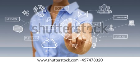 Businessman connecting multimedia icons together with his hand