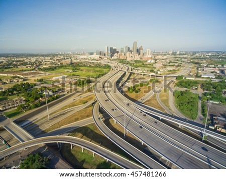 Aerial view Houston downtown and interstate 69 highway with massive intersection, stack interchange and elevated road junction overpass at early morning from the northeast side of Houston, Texas, USA