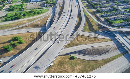 Panorama aerial view massive interstate I69 highway intersection, stack interchange with elevated road junction overpass in downtown Houston. This five-level freeway interchange carry heavy traffic.