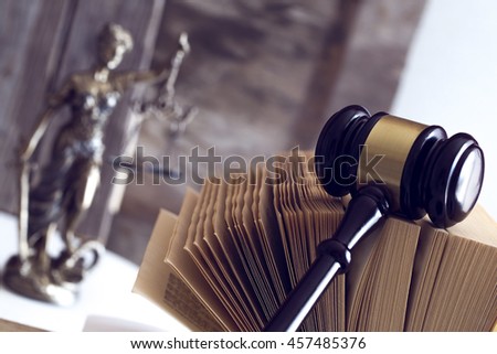 Law concept. Judge gavel, statue and book