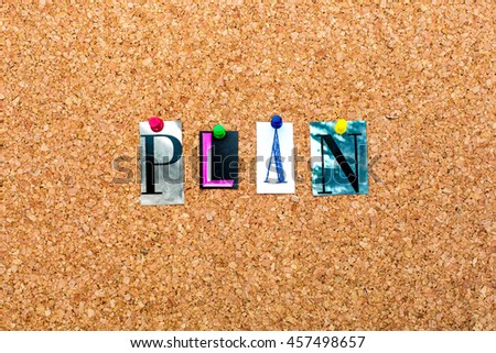 Top view creative studio photo of table with paper word PLAN