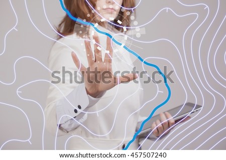 Geographic information systems concept, woman scientist working with futuristic GIS interface on a transparent screen. Royalty-Free Stock Photo #457507240
