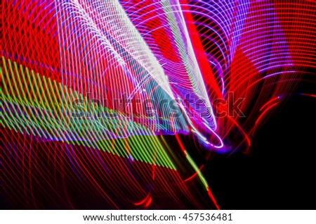 Light effects  with blurred magic neon light curved lines