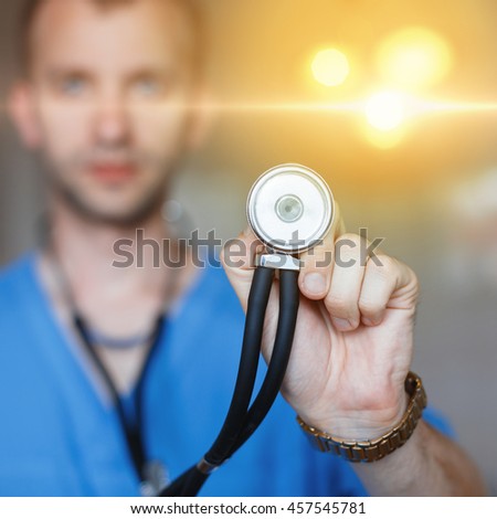 Doctor checks the health of the patient. Stethoscope in hand