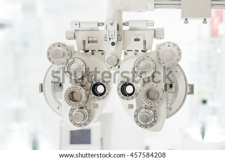 Eye sight vision test machine with white tone blurry lab background Royalty-Free Stock Photo #457584208