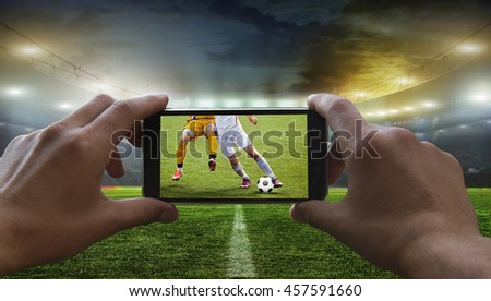   Football fan removes the football game on mobile phone