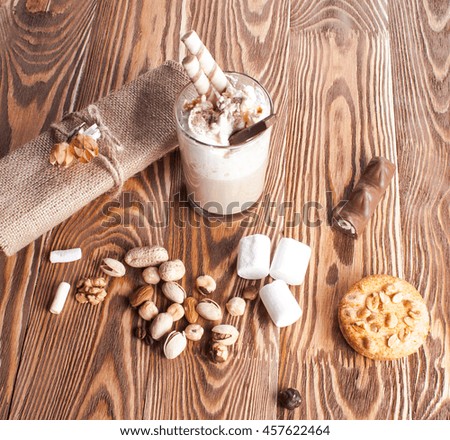 Coffee with marshmallows on the boards. Breakfast