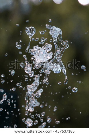 picture of a water drops from fountain. Selective focus
