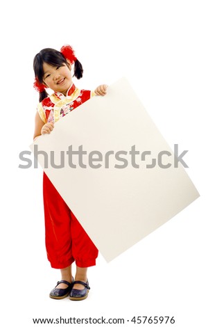 Friendly little Asian girl holding a banner ad isolated over a white background