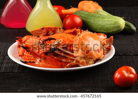 Sea food dish with boiled crabs and vegetables.
