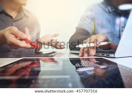Business team meeting present. Photo professional investor working with new startup project. Finance managers task.Digital tablet laptop computer design smart phone using.  Sun flare effect Royalty-Free Stock Photo #457707316