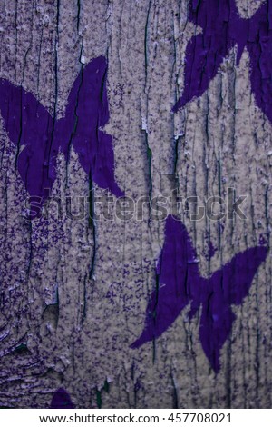 Wooden colorful background with butterflies. Texture.