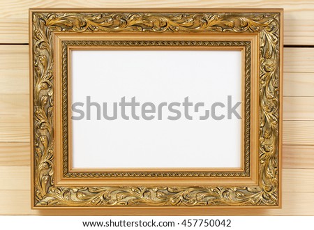 Frame on wooden wall. Copy space.