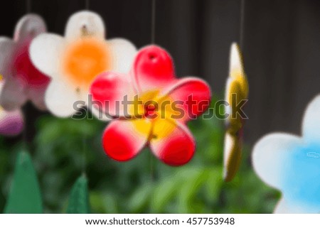 blurred flowers mobile hanging on roof for decoration, vintage styling, Selective focus.