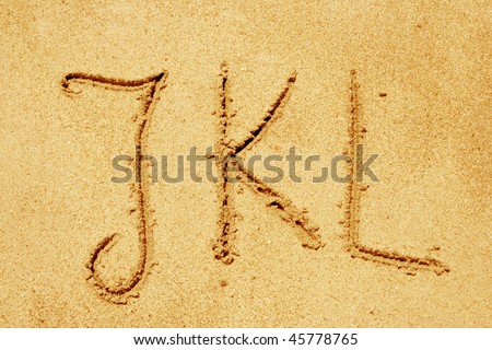 Concept or conceptual abstract set or collection of fonts in sand on exotic beach sea shore handwritten in a sandy texture background in summer for alphabet,education,letter,text,vacation or tourism Royalty-Free Stock Photo #45778765