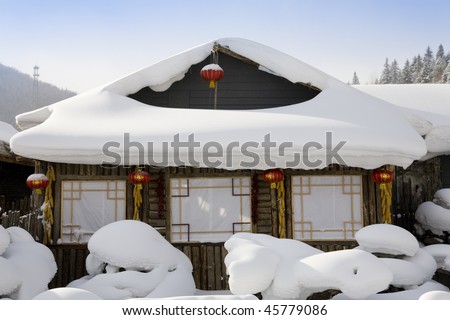snow-covered wooden house. ( The Chinese characters on the red lanterns means "Luck and good futureâ??)