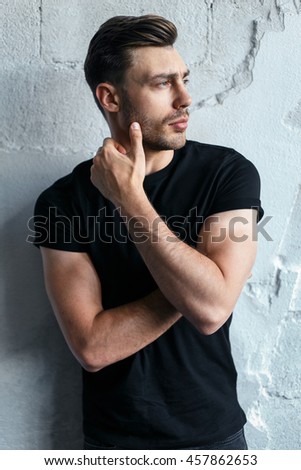 young man on a wall background