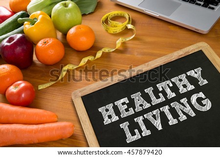 HEALTHY LIVING Fitness and weight loss concept, fruit and tape measure on a wooden table, top view
