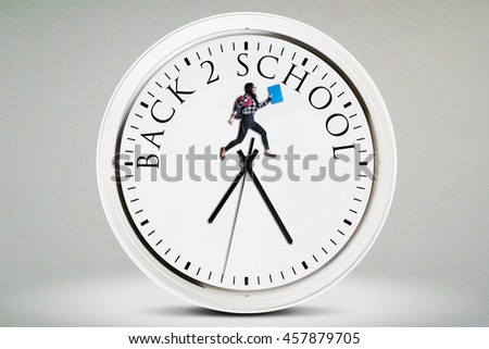 Picture of a female high school student jumping on a big clock with a text of Back to School