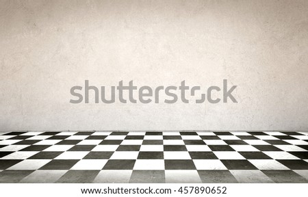 Concrete wall and checkerboard floor 
