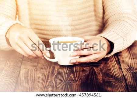 woman hands and wooden table with fog and coffee 
