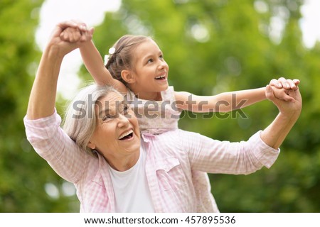 Grandmother with granddaughter  in park Royalty-Free Stock Photo #457895536