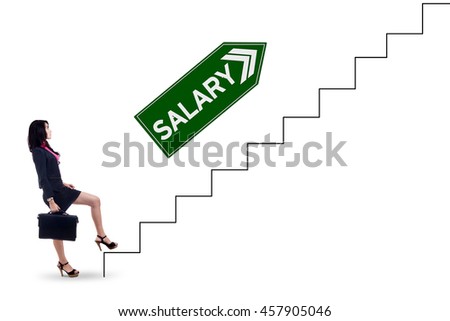 Picture of a female worker carrying bag and walking upward on the stairs with salary text on the signpost